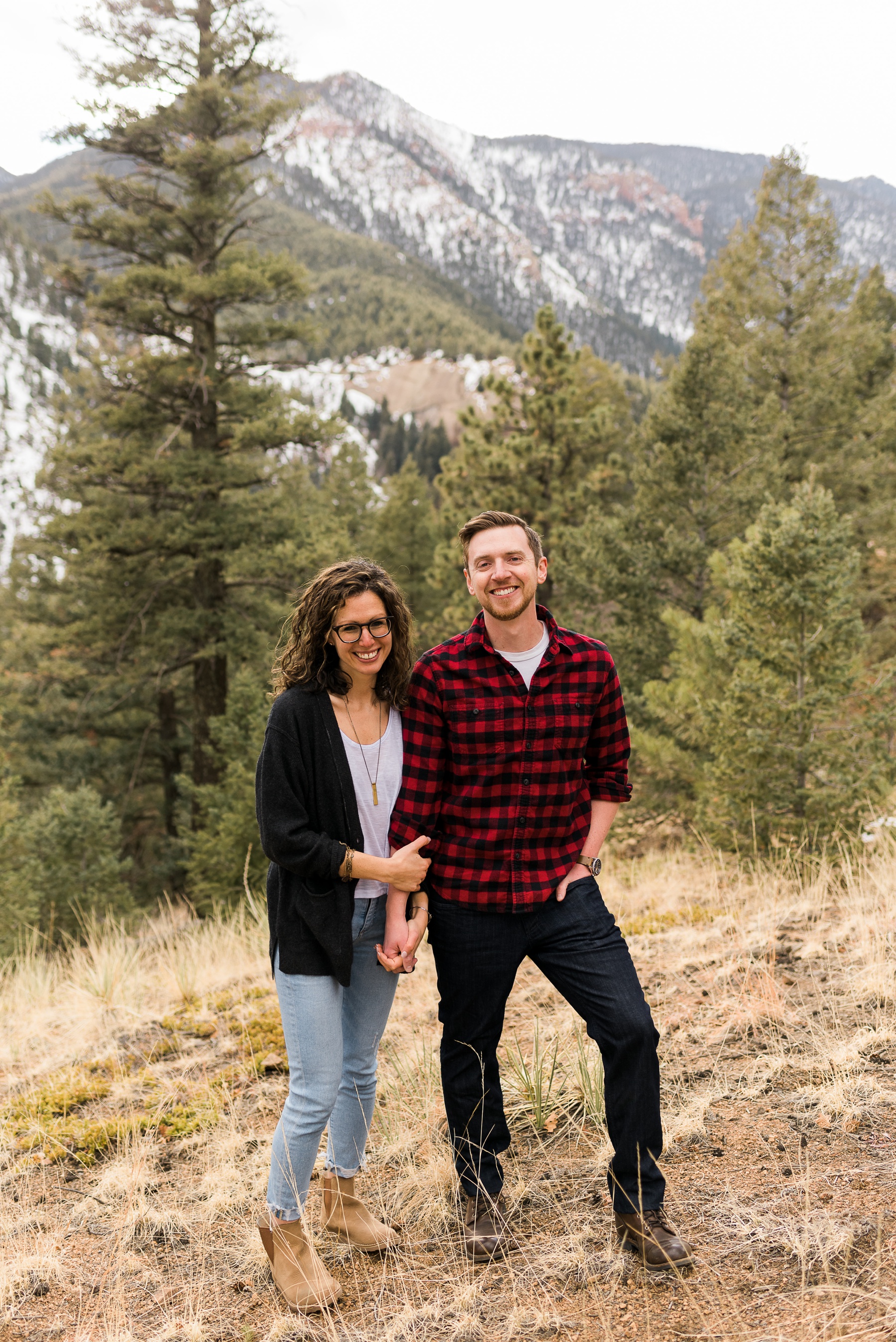 Couple smiling with mountains in the background