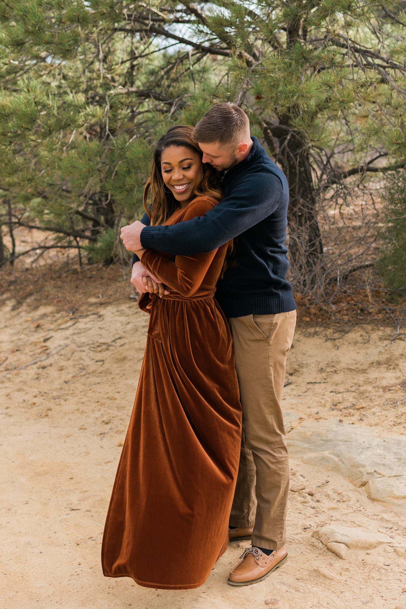 Couple holding each other during Colorado Springs engagement photos