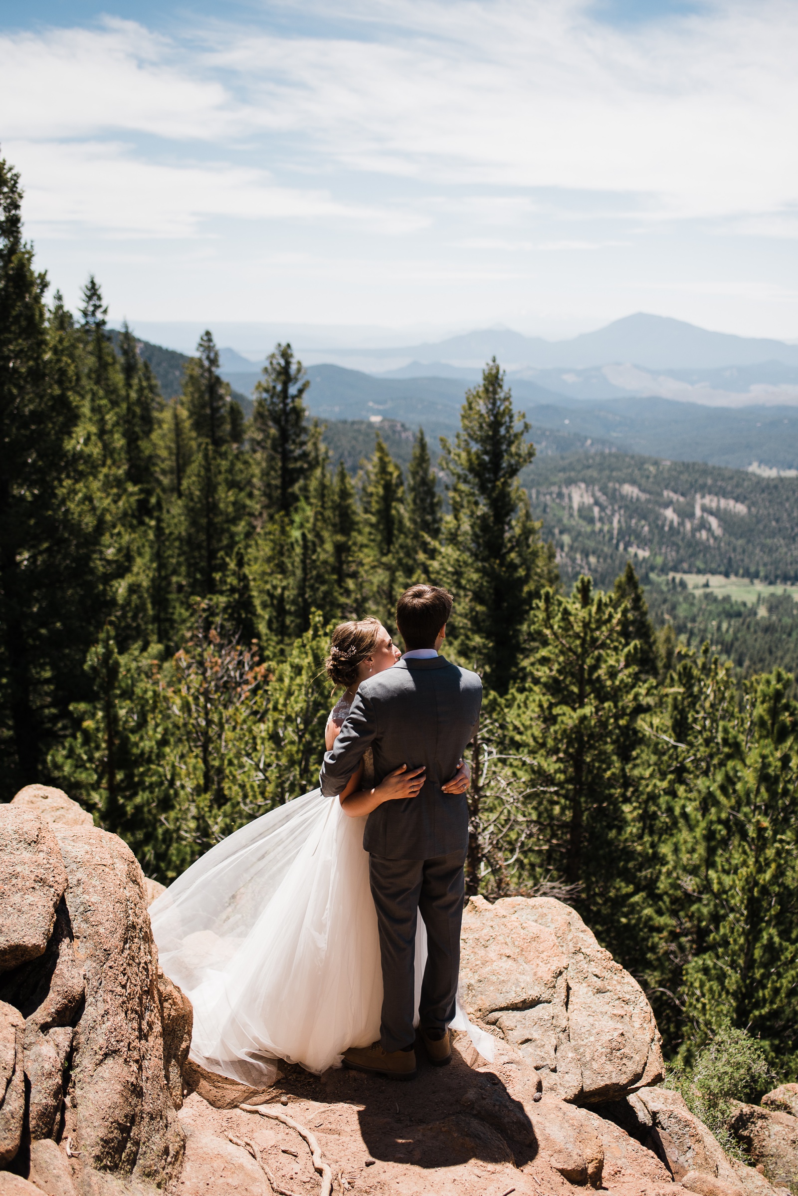 Bride and Groom looking at mountains