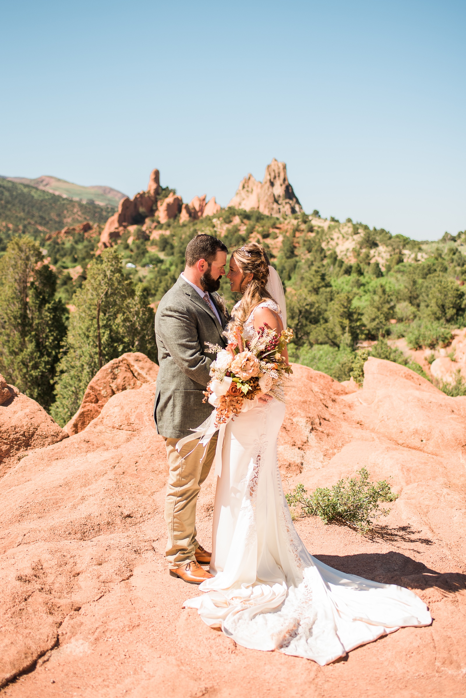 Bride and Groom looking at each other at Garden of the Gods.